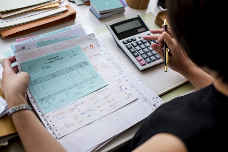asian woman working through paperwork scaled q89hqejffix8i1ylxcqtatwye1hzqvh6hnq1uv2w40